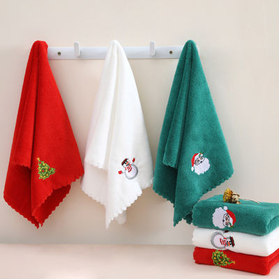 Gepaard met een cadeautje zachte en absorberende kersthanddoek in koraal fluweel voor het jaar