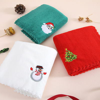 Gepaard met een cadeautje zachte en absorberende kersthanddoek in koraal fluweel voor het jaar